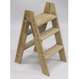A PAIR OF NOVELTY WOODEN STEPS. 2ft 10ins high.