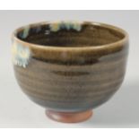 A CONTEMPORARY JAPANESE GLAZED POTTERY BOWL, signed, in original wooden box, bowl 12cm diameter.