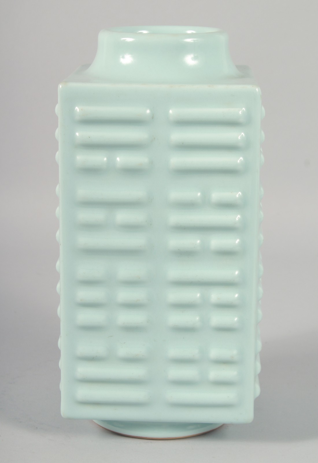 A CHINESE CELADON GLAZE SQUARE FORM ZUN VASE, the base with six-character mark, 27.5cm high.