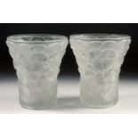 A PAIR OF LALIQUE GLASS VASES each with a moulded flower head design. 5.75ins high.