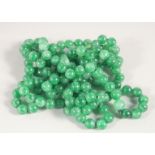 A JADE BEAD NECKLACE. 136cm long