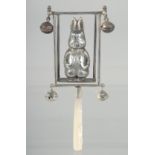 A SILVER MOTHER OF PEARL PETER RABBIT RATTLE.