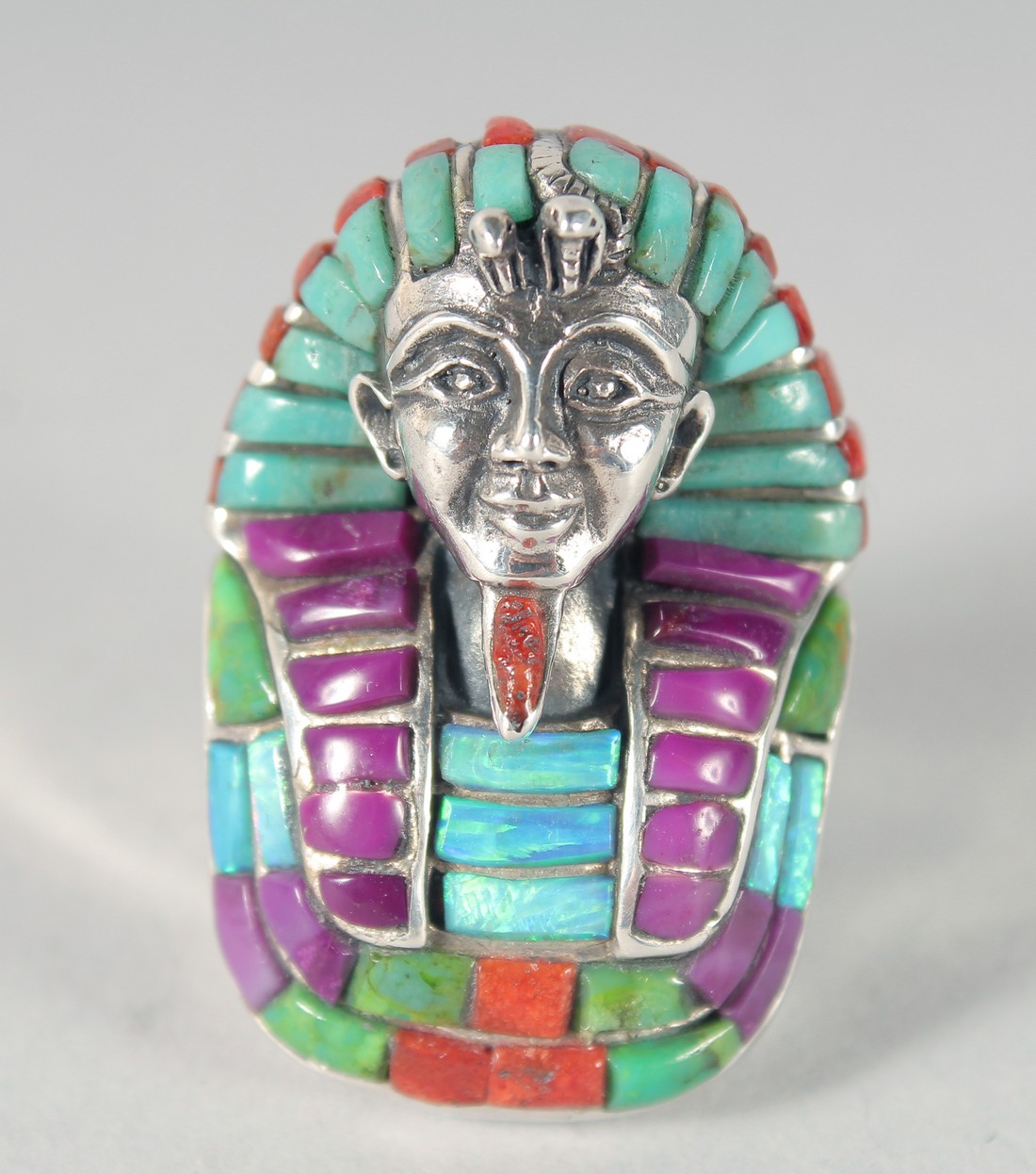 A SILVER EGYPTIAN OPAL, CORAL AND TURQUOISE RING.