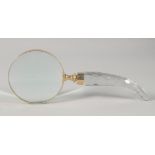 A MAGNIFYING GLASS with cut glass handle.