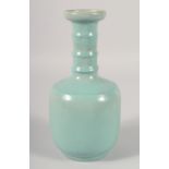A CHINESE CELADON GLAZE VASE, with ribbed neck, 25.5cm high.