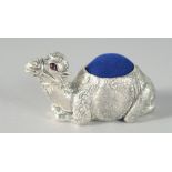 A SILVER-PLATED CAMEL PIN CUSHION. 5cm