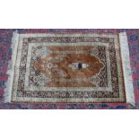 A SMALL PERSIAN SILK PRAYER RUG, brown ground with temple arch and hanging lantern. 3'1" x 2'0"