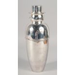 A SILVER-PLATED SNOWMAN COCKTAIL SHAKER. 10.25" high