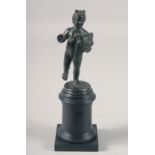 A NEOPOLITAN SCHOOL BRONZE CUPID on a wooden stand. 4.5ins high.