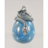 A SILVER MOUNTED LAPIS EGG SHAPED PENDANT. 3cm high