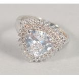 A DECORATIVE SILVER AND CZ RING.