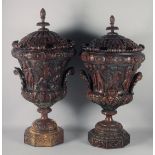 AN IMPRESSIVE PAIR OF CARVED WOOD PEDESTAL URN AND COVERS. 36ins high.