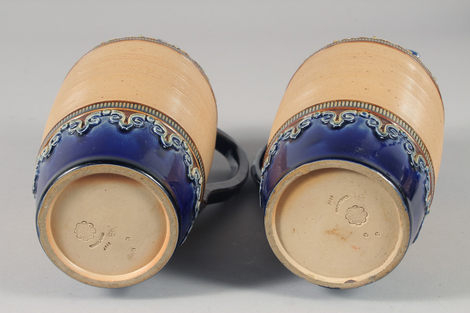 A PAIR OF ROYAL DOULTON STONEWARE JUGS with blue bands. 8ins high. - Image 6 of 6