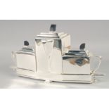 AN ART DECO STYLE PLATED THREE PIECE TEA SERVICE ON STAND. 15.5" long