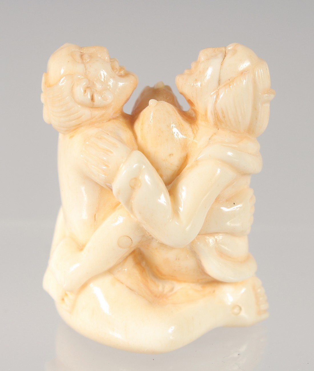 A CHINESE CARVED BONE EROTIC NETSUKE. 4.5cm. - Image 2 of 3