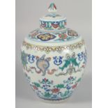 A CHINESE DOUCAI PORCELAIN GINGER JAR AND COVER, decorated with lotus and auspicious symbols, the