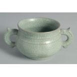 A CHINESE CELADON TWIN HANDLE CENSER, 15cm wide (handle to handle).