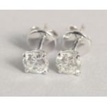 A GOOD PAIR OF SINGLE STONE DIAMOND EARRINGS, approx. .75 carat each.