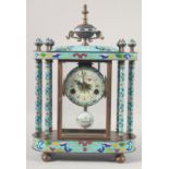 A DECORATIVE BRONZE AND CLOISONNE ENAMEL PILLAR MANTEL CLOCK with urn finial. 18ins high.