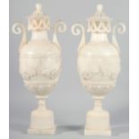 A VERY GOOD PAIR OF 19TH CENTURY FRENCH ALABASTER, TWO HANDLED URNS AND COVERS, carved with garlands