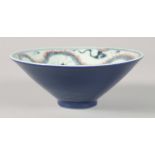 A CHINESE BLUE, RED AND WHITE PORCELAIN BOWL, painted with dragon to the interior, character mark to