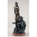 A GOOD LARGE BRONZE OF A STANDING FEMALE NUDE, with an Arab man seated by her side. 27ins high.
