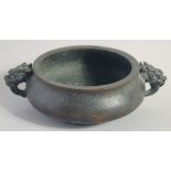 A CHINESE BRONZE TWIN HANDLE CENSER, the handles formed as dragon heads, character mark to base,