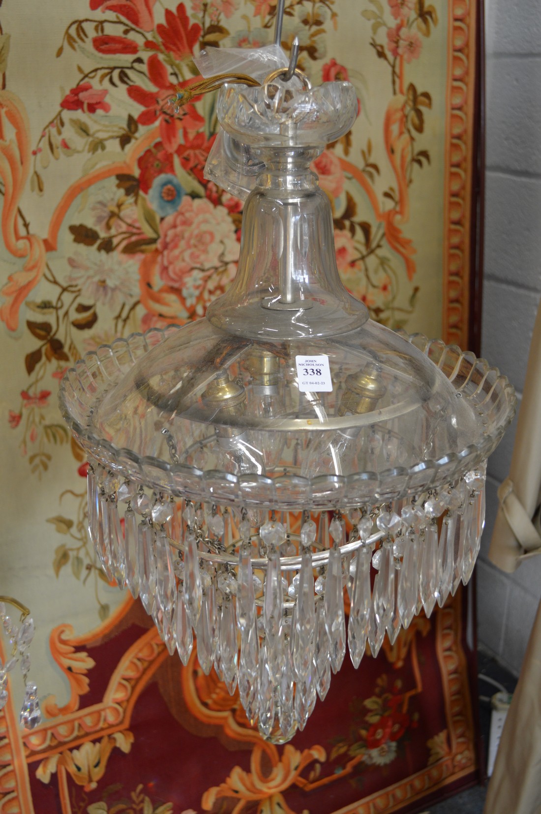 A cut glass three tier chandelier.