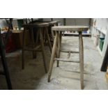 A set of four beech stools.