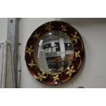 A decorative circular mirror.