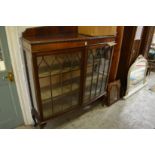 A mahogany display cabinet.