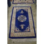 A Chinese blue ground rug 5' x 3'.