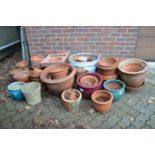 A large quantity of terracotta and other plant pots.