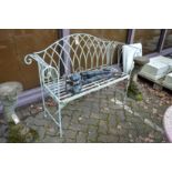 A small wrought iron garden bench.