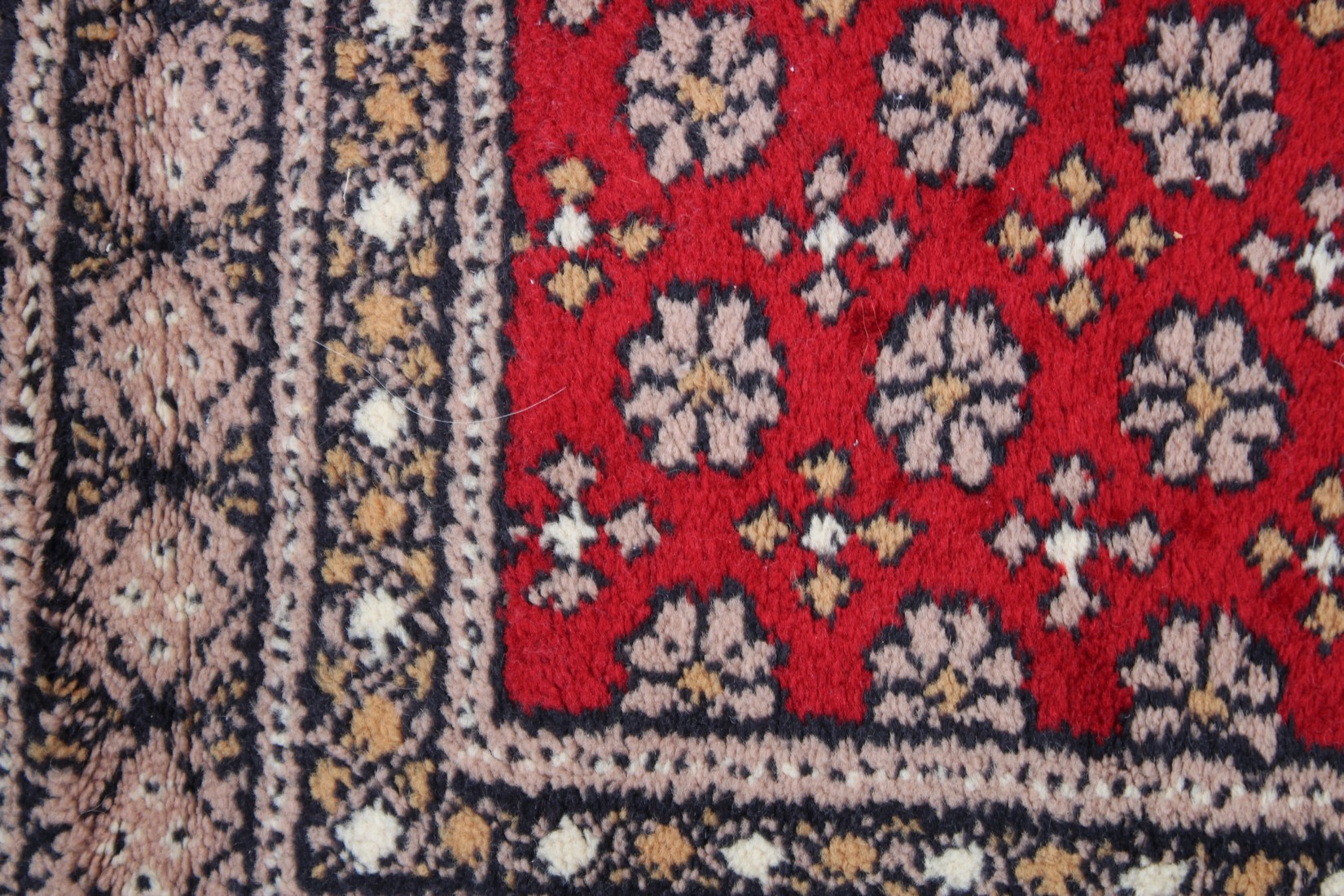 A modern Persian design rug, central red ground with all over stylised decoration 4'7" x 2'3". - Image 2 of 3