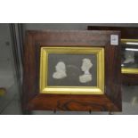 A set of three 19th century rosewood framed plaques depicting relief cast busts of ladies and
