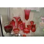 A collection of cranberry glassware.