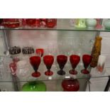 A shelf of glassware to include a pair of decanters, Galle style vase etc.