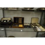 Cased plated flatware and various empty cutlery cases.