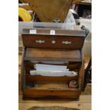 An oak stationery cabinet.