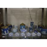 A collection of Wedgwood blue jasperware to include biscuit barrels, boxes and covers etc.