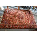 A Persian carpet, cream ground with all over floral decoration, ends worn 6'10" x 4'8".