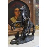 A large spelter model of a Marley horse and handler.
