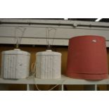 A pair of large pottery table lamps and shades.