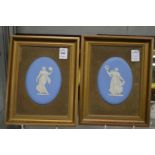 A pair of blue jasperware oval plaques, framed.