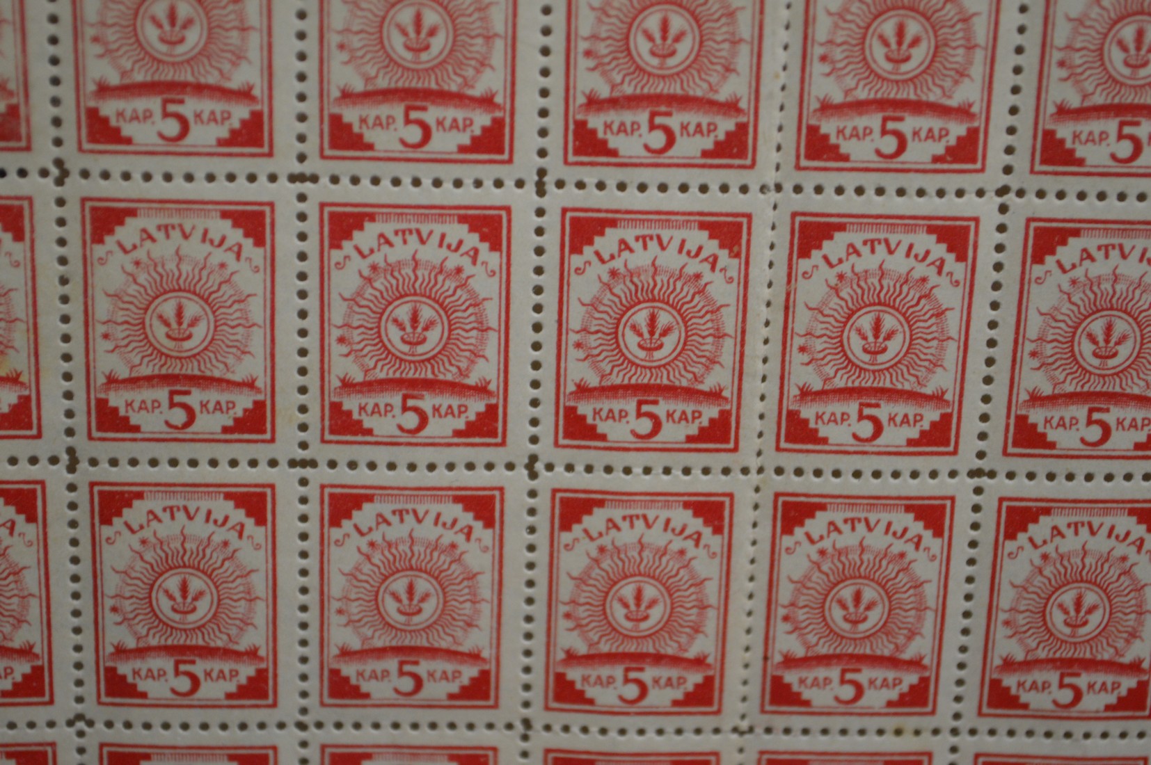 An unusual collection of Latvian five Kap stamps, perforated but intact, the back printed with a map - Image 2 of 3