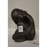 Austin bronze sculpture of a crouching female figure.