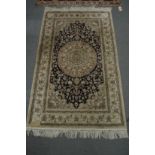 A good Persian design part silk rug, pale cream and blue ground with stylised floral decoration 5'1"