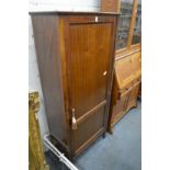 A mahogany storage cupboard.