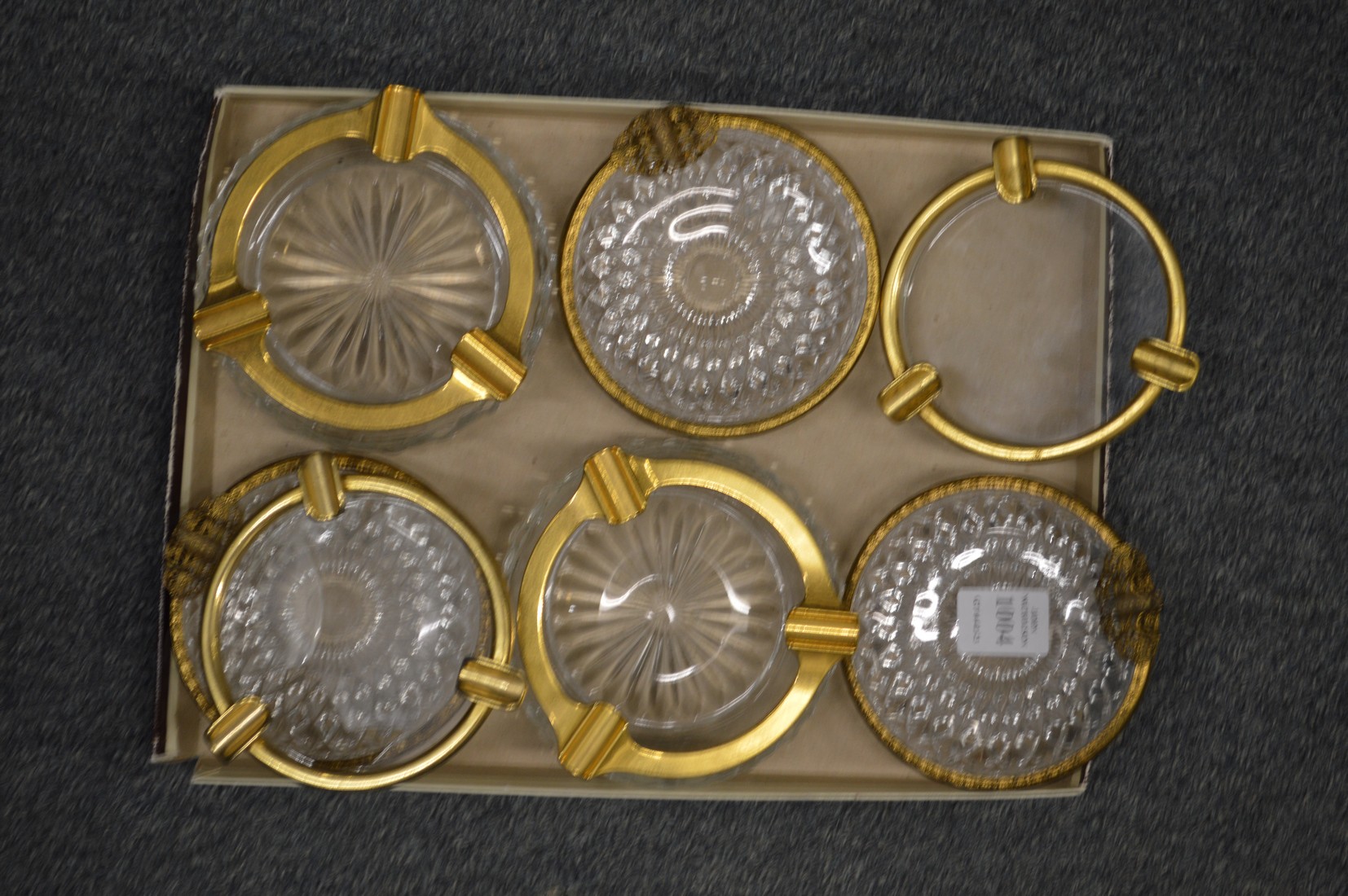 Various glass and ormolu mounted ashtrays.